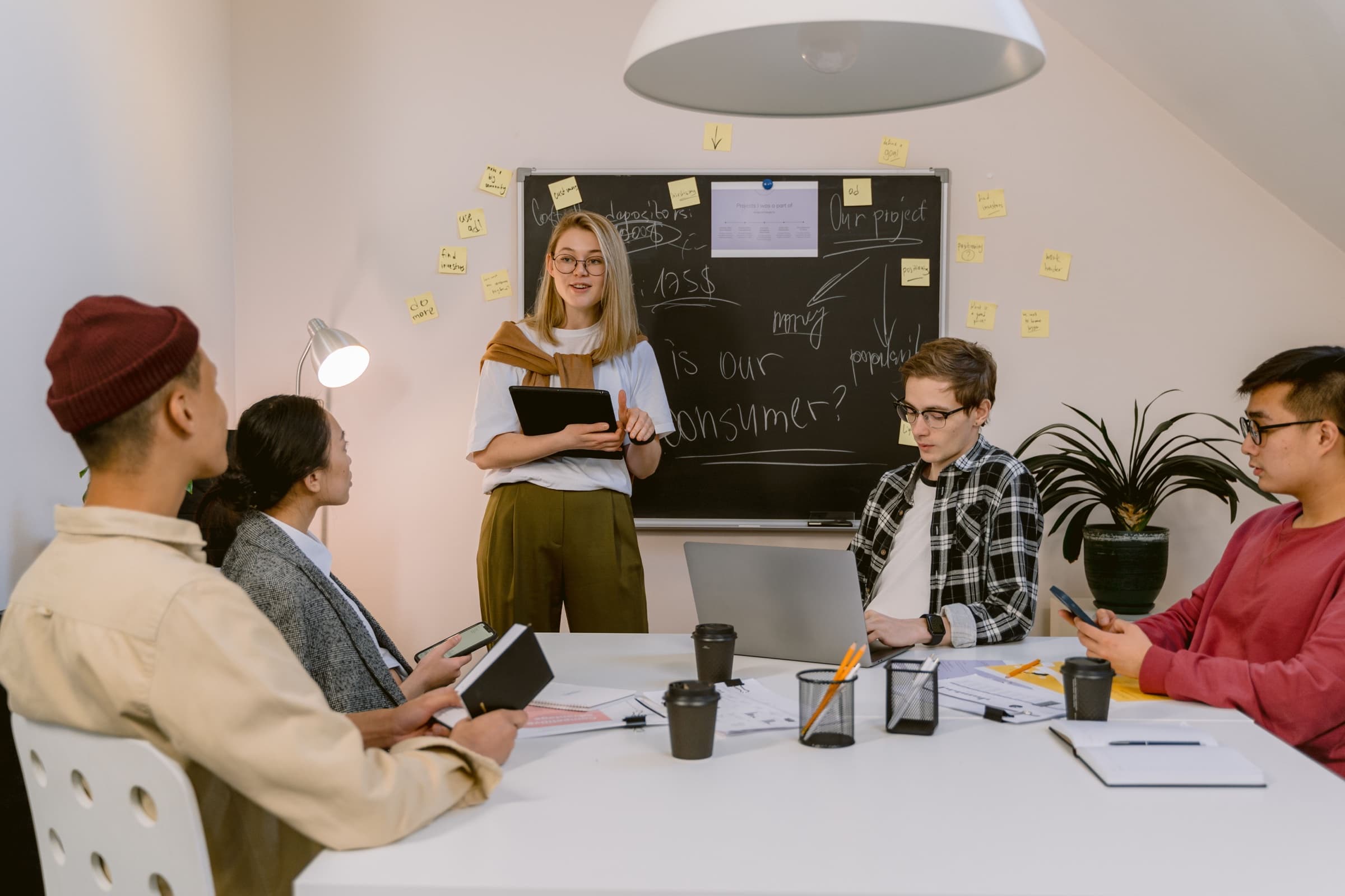 A diverse group collaborating around a table during a planning session